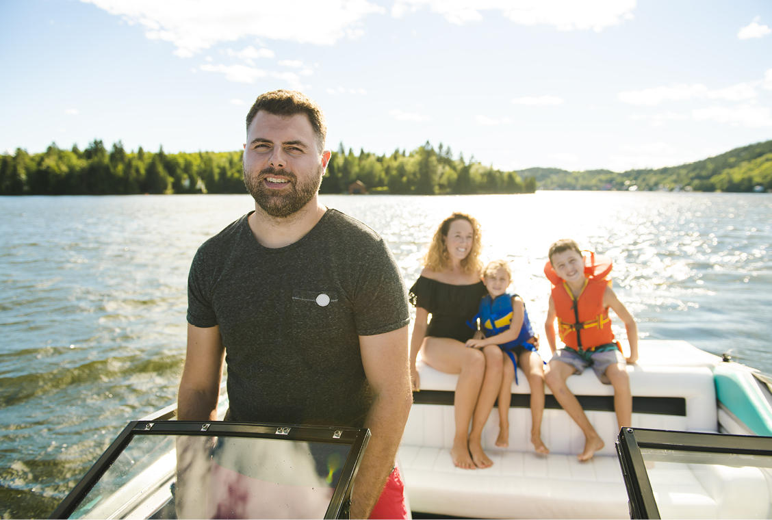 Person Driving Boat on Lake