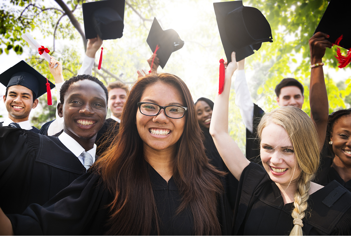 New graduates celebrating after graduation ceremony